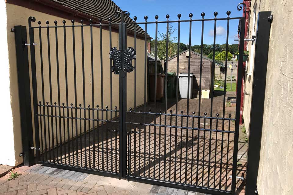 Wrought Iron Gate and Wall Posts